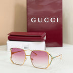 Gucci oversized square sunglasses with gold frame and gradient rose lenses
