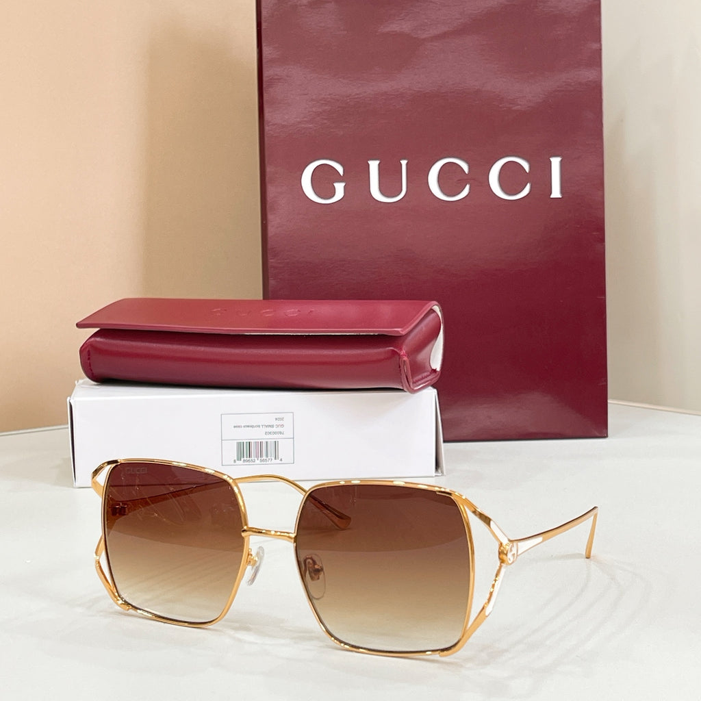 Gucci oversized square sunglasses with gold frame and gradient brown lenses