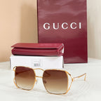 Gucci oversized square sunglasses with gold frame and gradient brown lenses