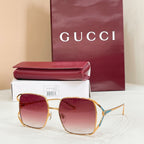 Gucci oversized square sunglasses with gold frame and rosy gradient lenses