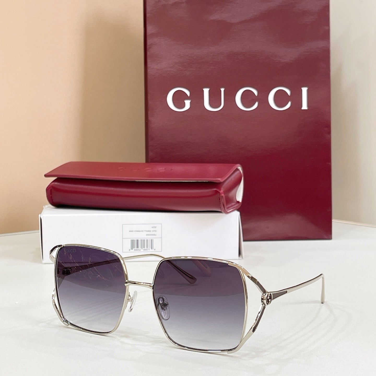 Gucci oversized square sunglasses with silver-toned frame and dark purple lenses