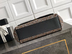 Chanel handbag with black flap top and houndstooth woven trim, black leather handles.
