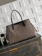Black and multicolor tweed handbag with black top handles and bow detail