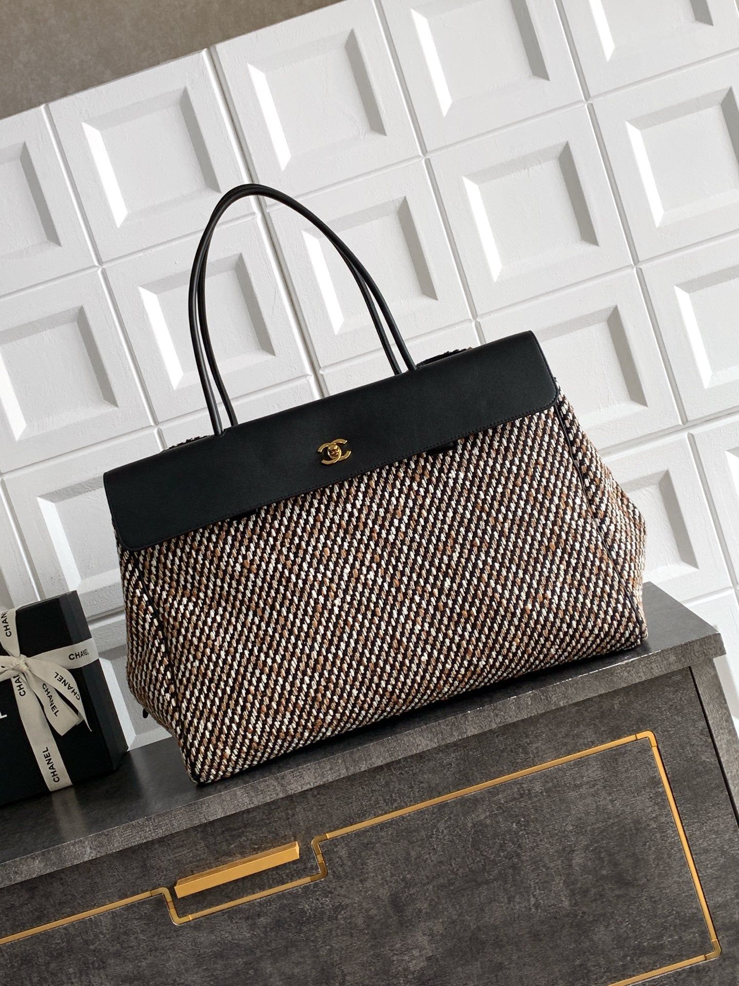 Black and multicolor tweed handbag with black top handles and front clasp detail