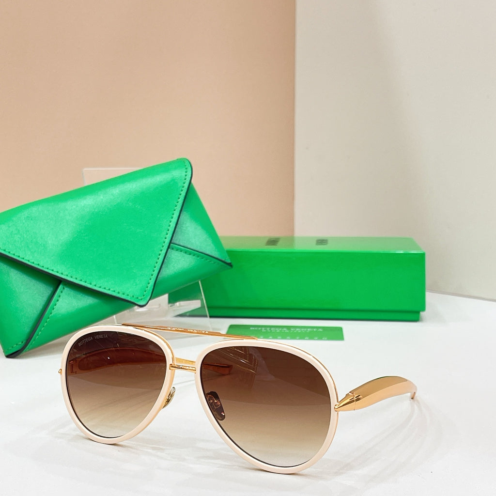 Round sunglasses with light frames and brown-tinted lenses