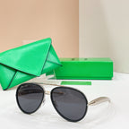 Round sunglasses with black frames and dark tinted lenses