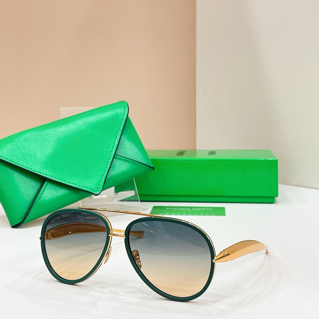 Round sunglasses with dark green frames and amber-tinted lenses