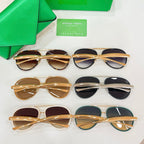 Assorted round sunglasses with gold and black frames on display