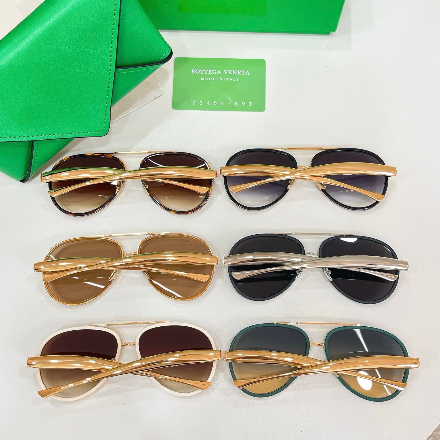 Assorted round sunglasses with gold and black frames on display