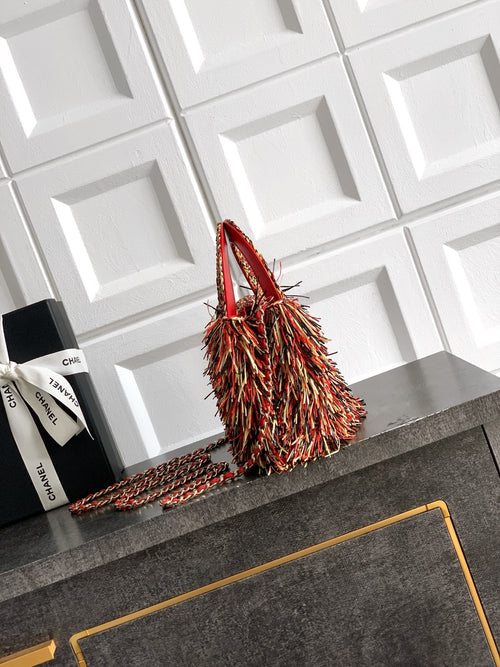 Chanel small handbag with red body, multicolor fringe top handle, chain strap