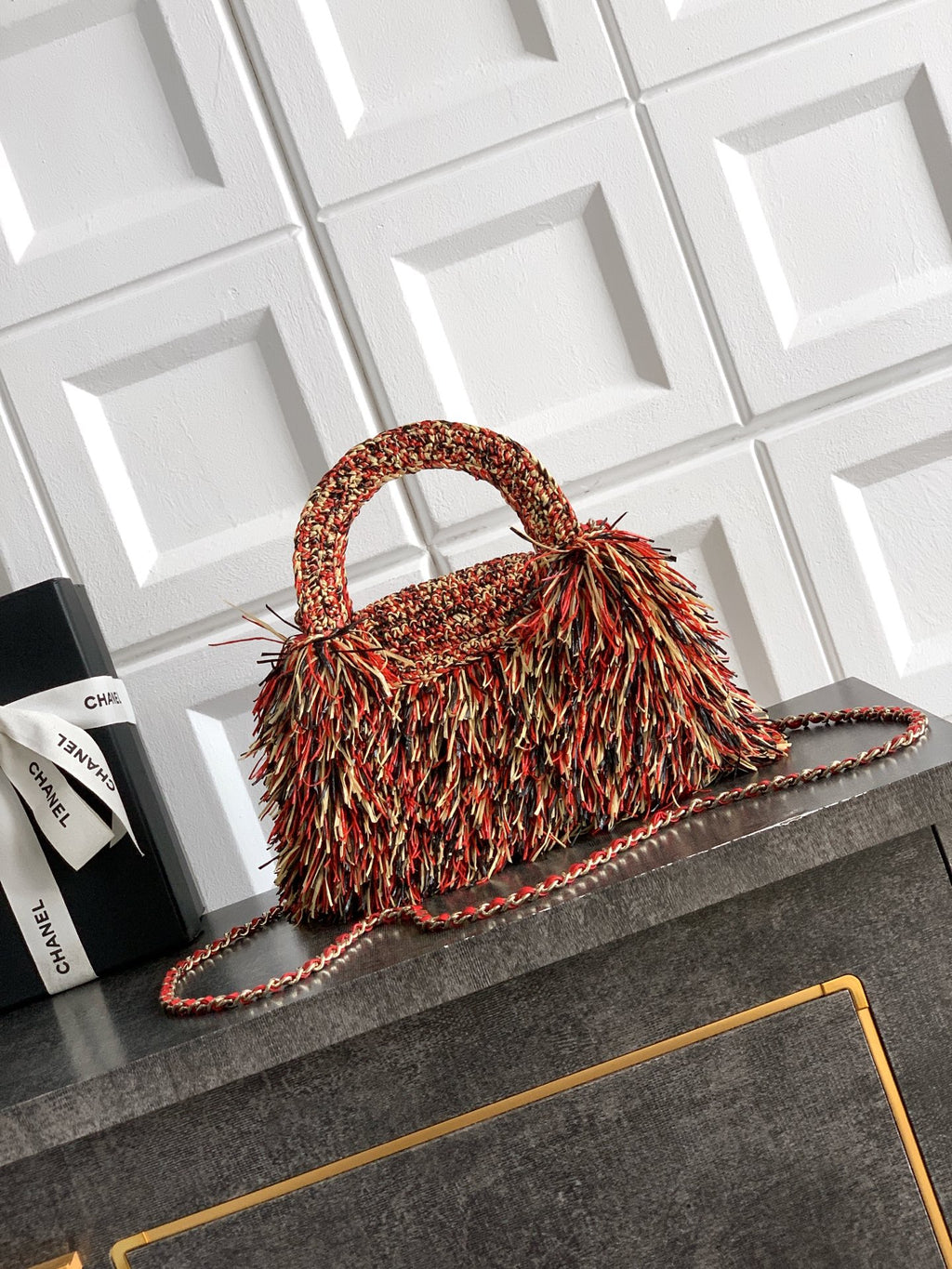 Chanel small fringe handbag with rounded top handle and chain strap