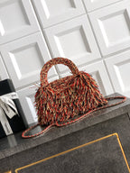 Chanel small fringe handbag with rounded top handle and chain strap