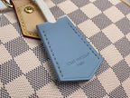 Louis Vuitton Damier handbag blue leather charm with stitched edge and logo text