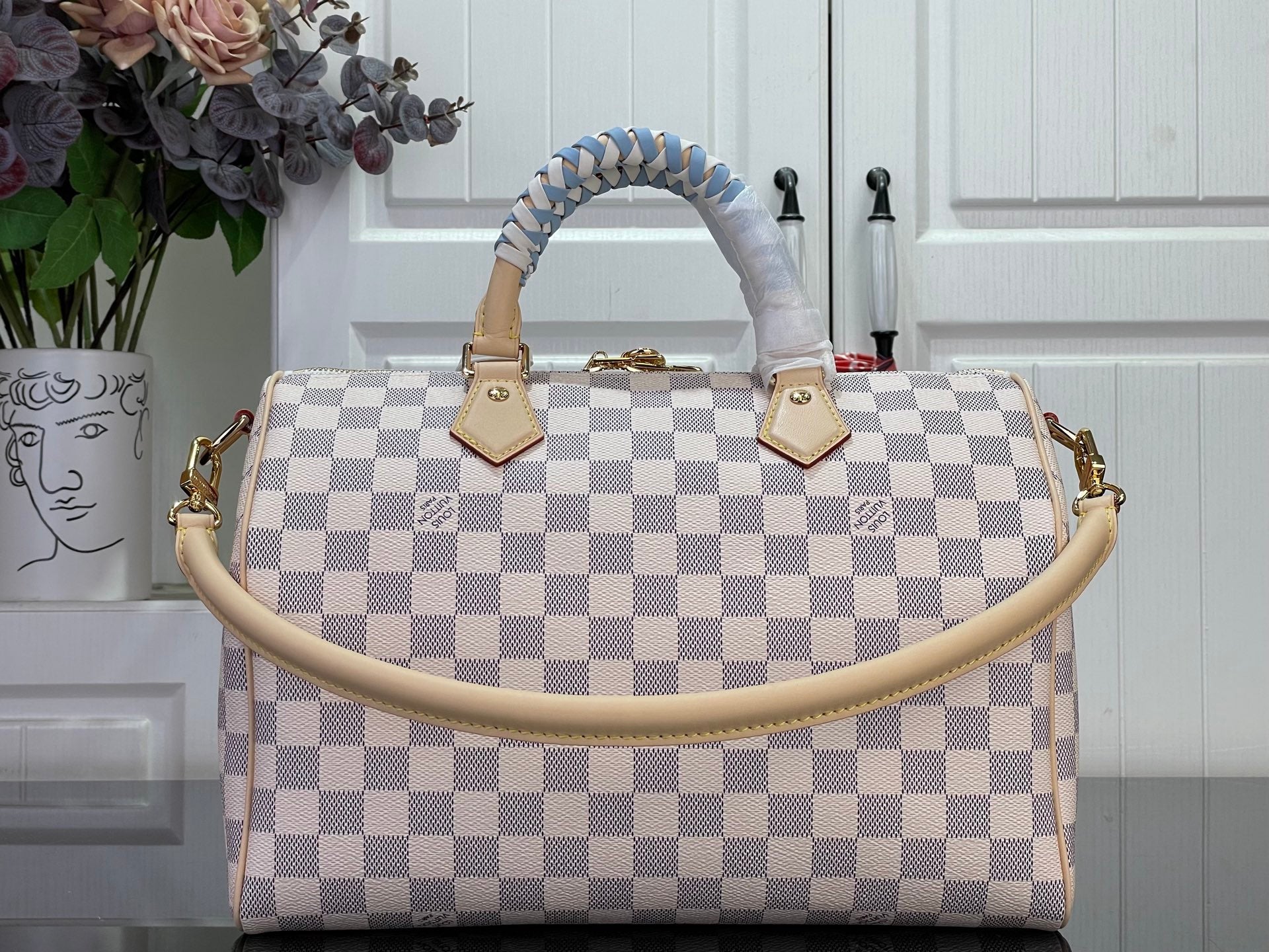 Louis Vuitton Damier checkered handbag with braided handles and small front charm