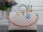 Louis Vuitton Damier checkered handbag with top handles and blue accessory tag