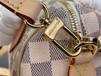 Louis Vuitton damier check shoulder strap clasp with gold hardware and leather tabs