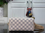 Louis Vuitton damier check bag with shoulder strap and gold zipper closure