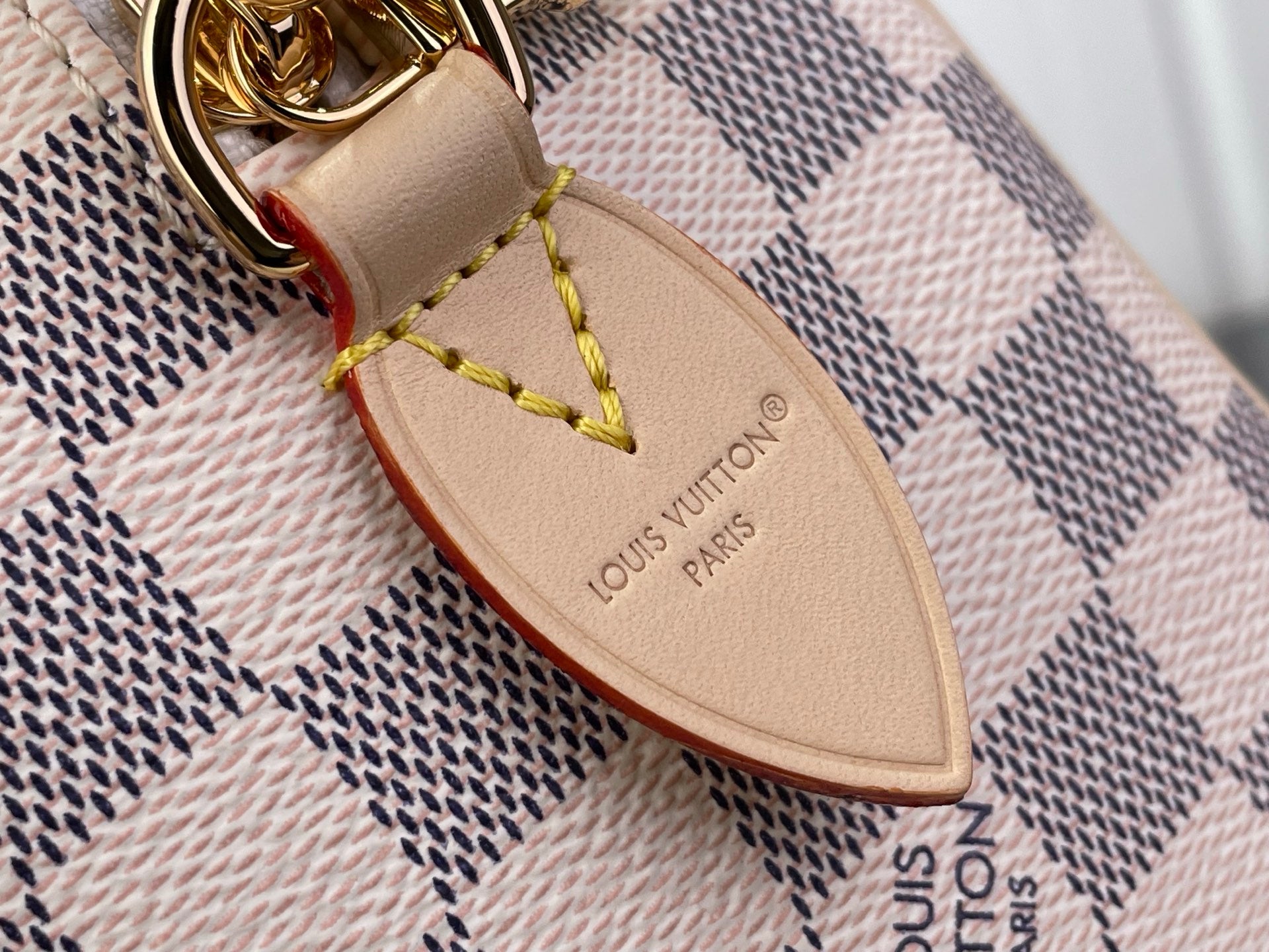 Louis Vuitton damier check leather nameplate on strap end with gold ring