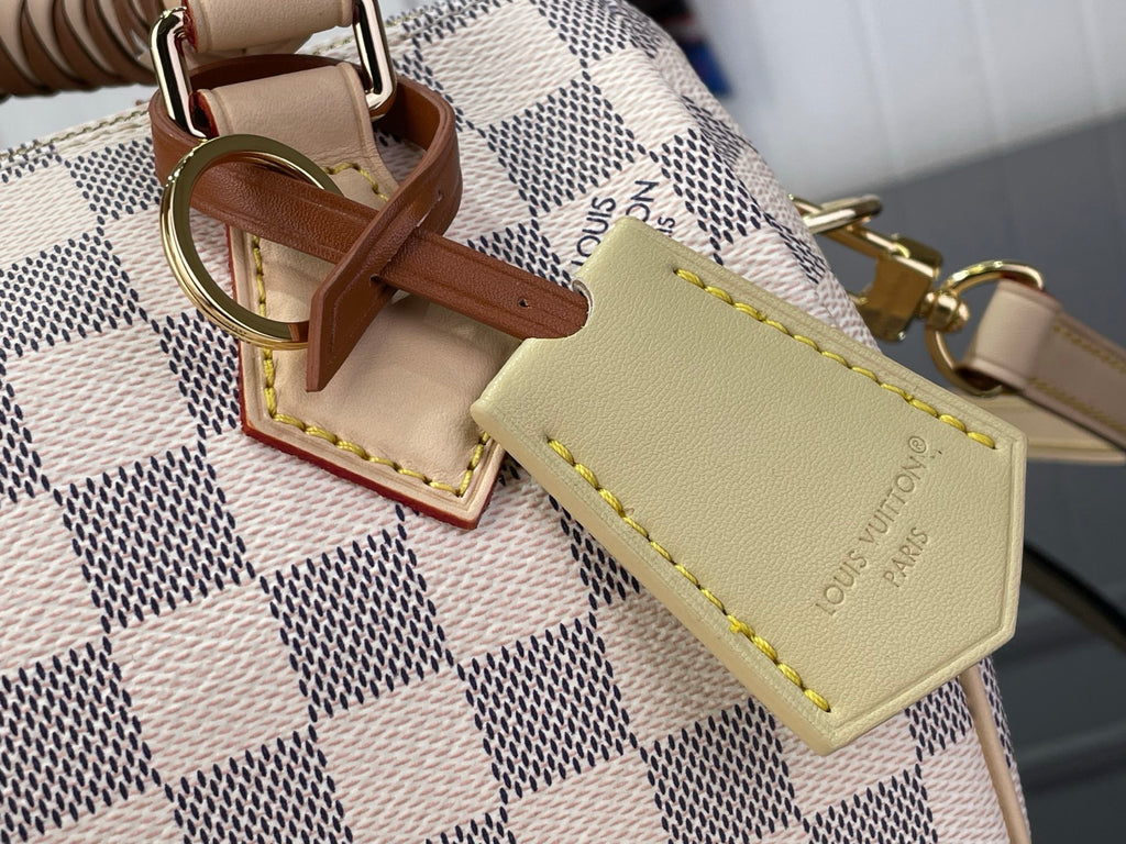 Louis Vuitton damier check handbag with tan leather trim and stitched luggage tag
