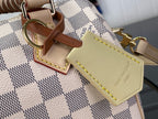 Louis Vuitton damier check handbag with tan leather trim and stitched luggage tag