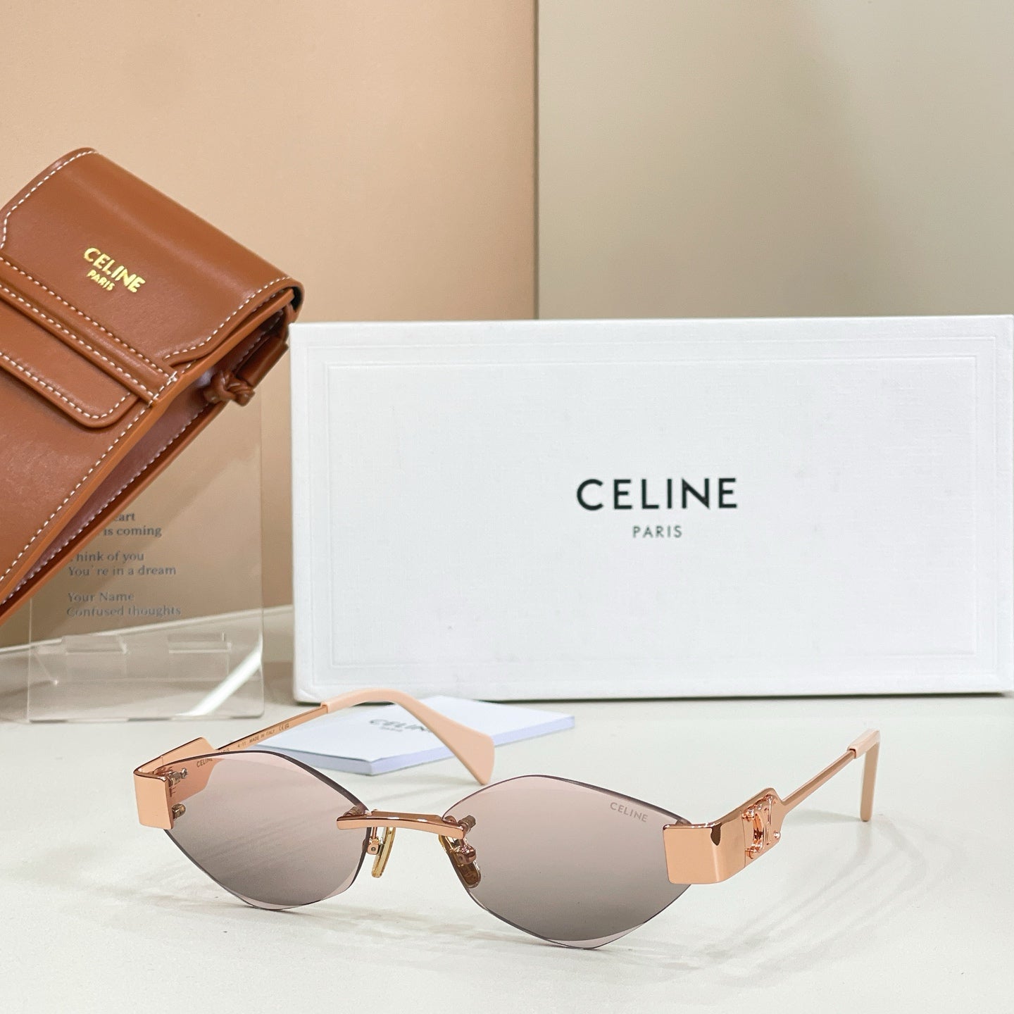 Celine sunglasses with light brown lenses, gold frame, tortoise temples