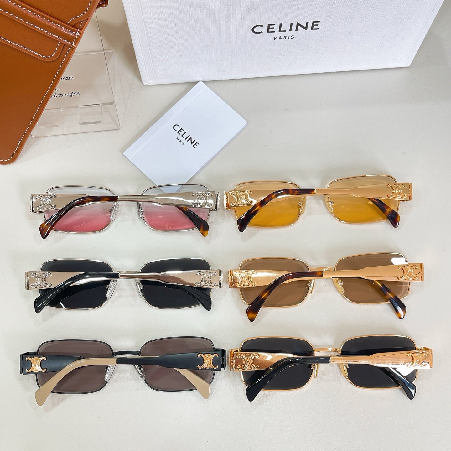 Set of six square sunglasses with assorted frames and tinted lenses, on a flat display