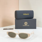 Versace sunglasses with white frames and green-tinted lenses
