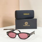 Versace sunglasses with tortoiseshell frames and pink gradient lenses