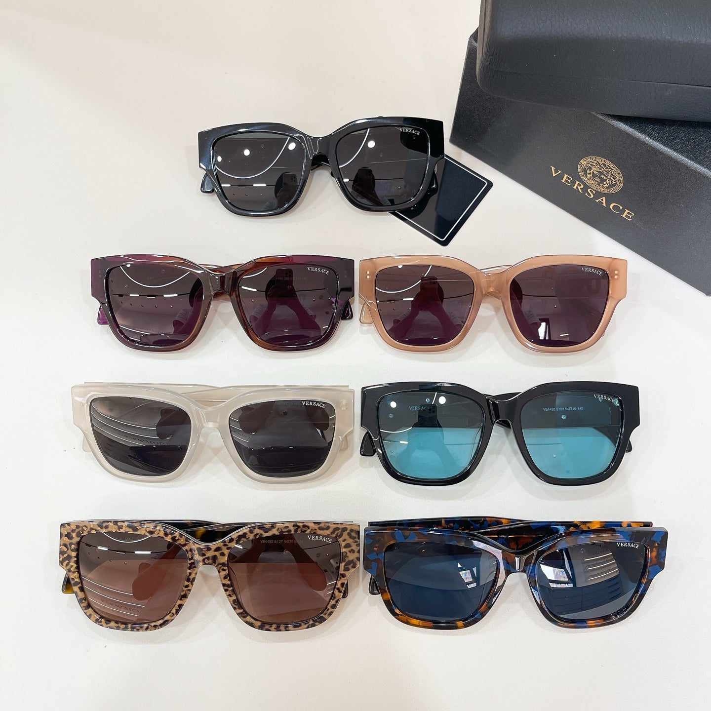 Assorted sunglasses display with multiple frame colors and dark lenses