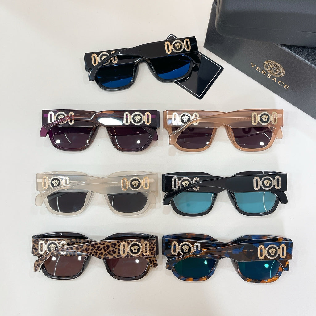Close-up of assorted square sunglasses with varied frames and tinted lenses