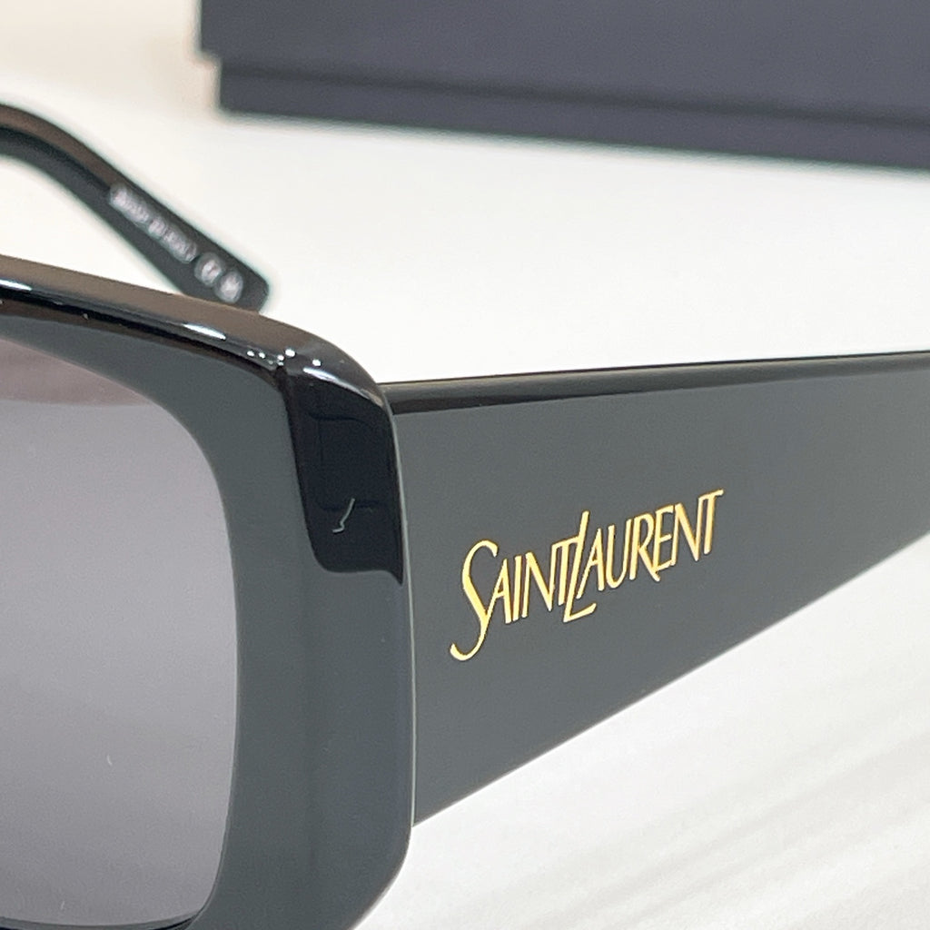 YSL sunglasses temple with Saint Laurent logo on dark frame