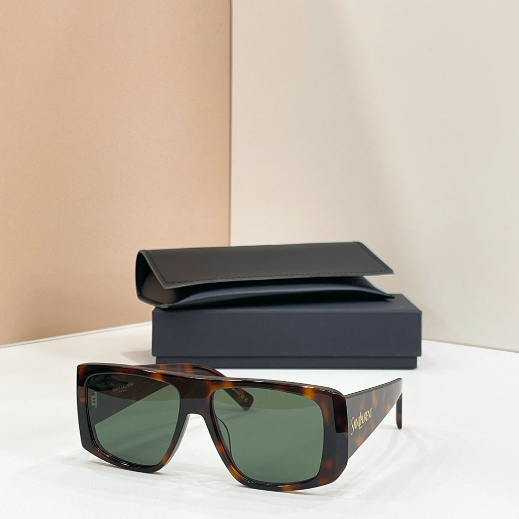YSL sunglasses with tortoiseshell frame and green-tinted lenses, with black case