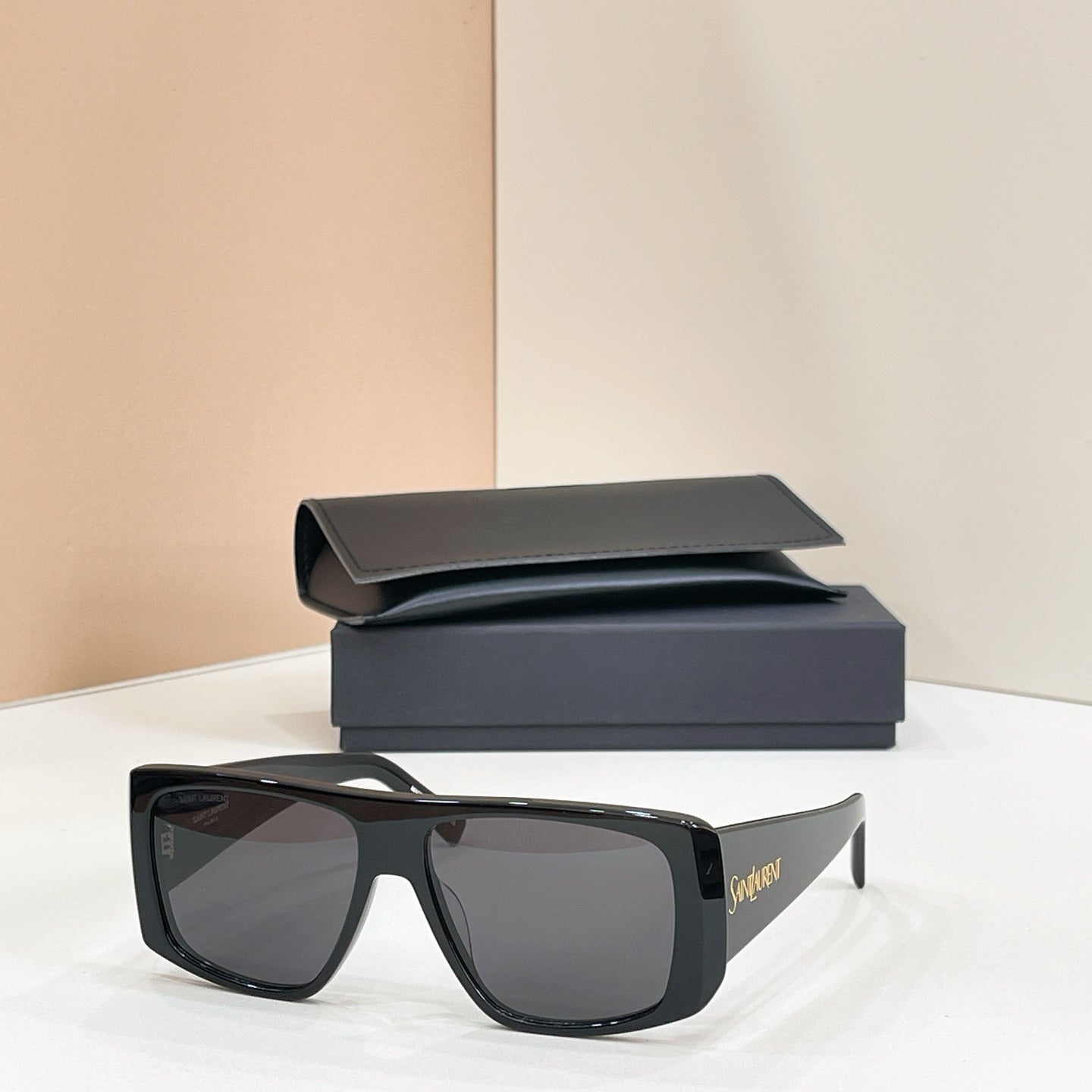 YSL sunglasses with black frame and dark lenses, with black case