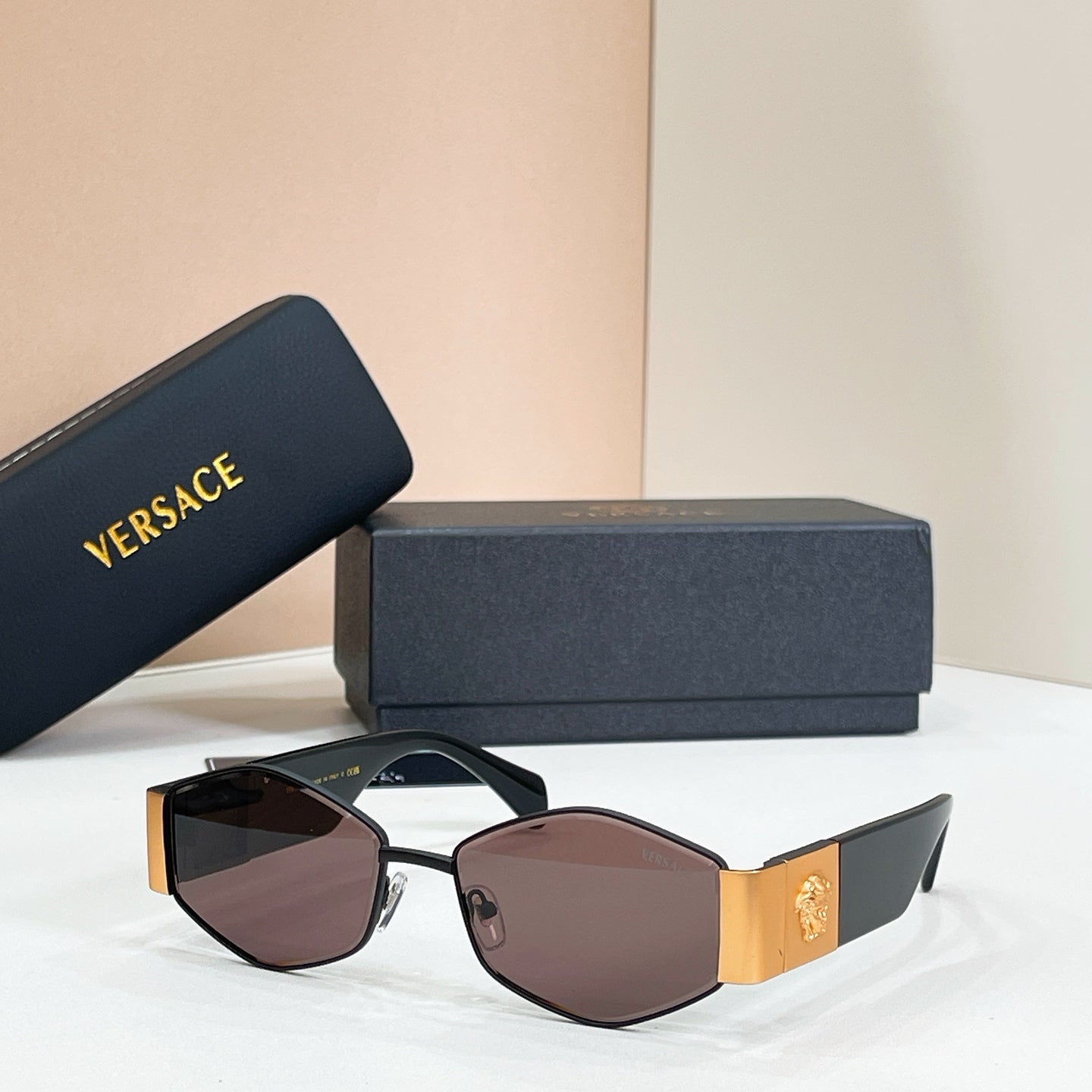 Versace octagonal sunglasses, black frame with gold trim and brown-tinted lenses
