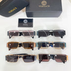Assorted sunglasses with black and gold frames beside a case and label card.