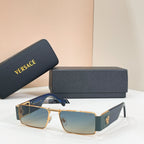 Rectangular sunglasses with gold frame, dark gradient lenses, and blue temples.