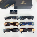 Assorted sunglasses with black, blue, and gold frames arranged in a grid.