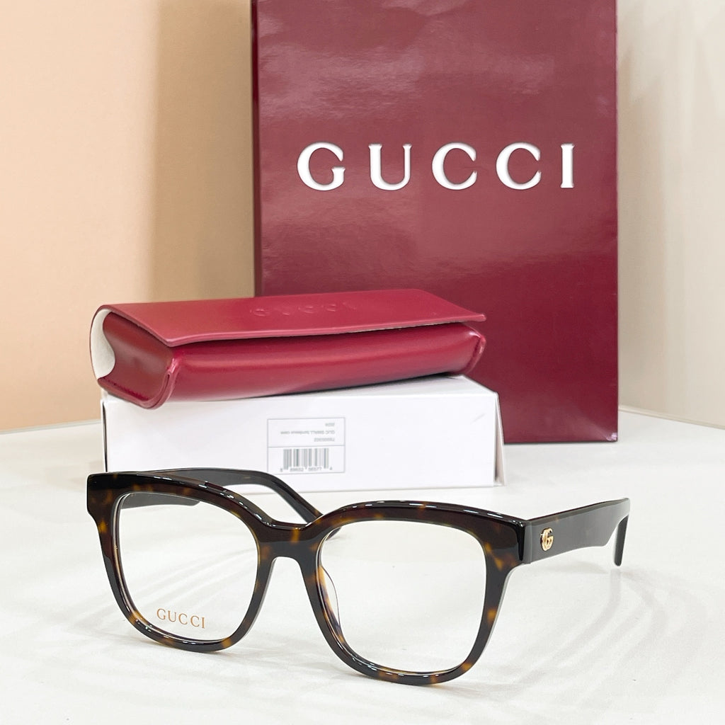 Gucci acetate glasses with dark tortoise frames and clear lenses