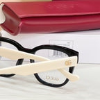 Gucci acetate glasses side view with cream temple and black frame, clear lens