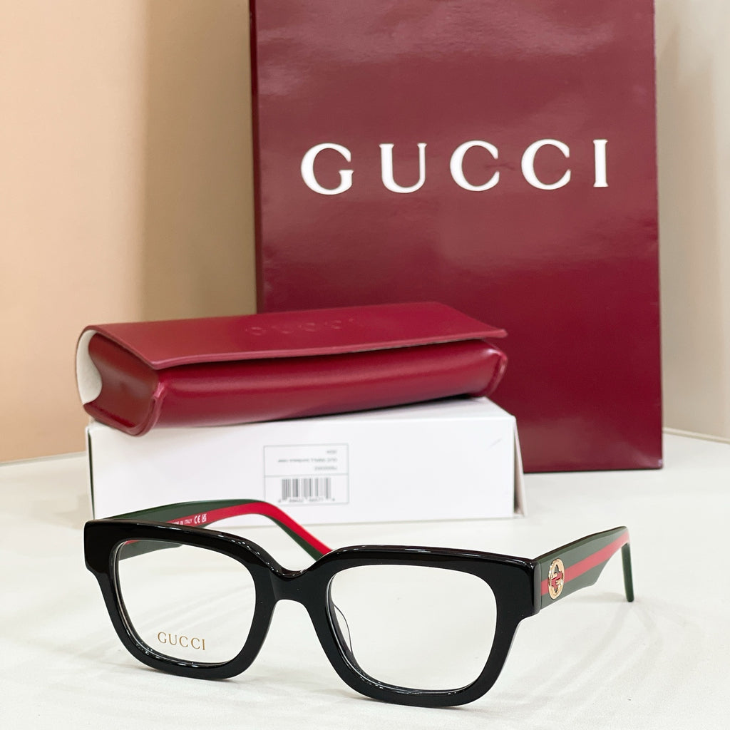 Gucci eyeglasses with black square frames and clear lenses, red-and-green temples
