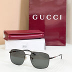 Gucci sunglasses with dark frame and dark tinted lenses