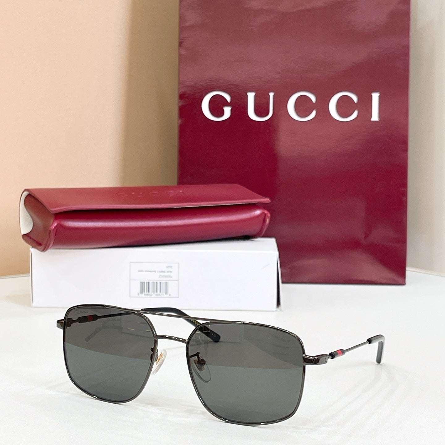 Gucci sunglasses with dark frame and dark tinted lenses