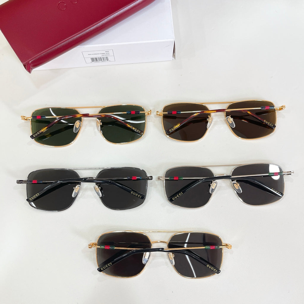 Assorted Gucci sunglasses with dark and green tinted lenses