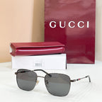 Gucci rectangular sunglasses with dark gray lenses and gold metal frame