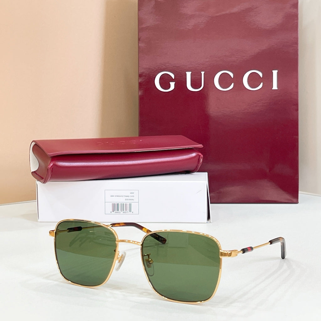 Gucci rectangular sunglasses with green-tinted lenses and gold metal frame