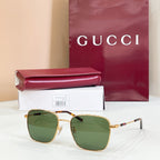 Gucci rectangular sunglasses with green-tinted lenses and gold metal frame