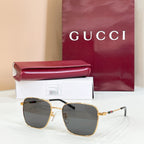 Gucci rectangular sunglasses with dark gray lenses and gold-tone metal frame