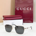 Gucci rectangular sunglasses with dark gray lenses and gold-tone metal frame