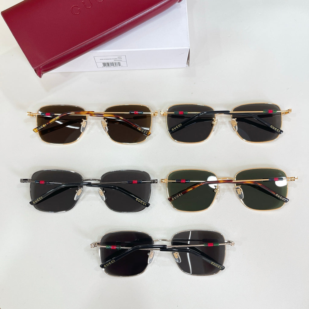 Gucci sunglasses assortment with seven pairs, dark lenses, and gold-tone frames