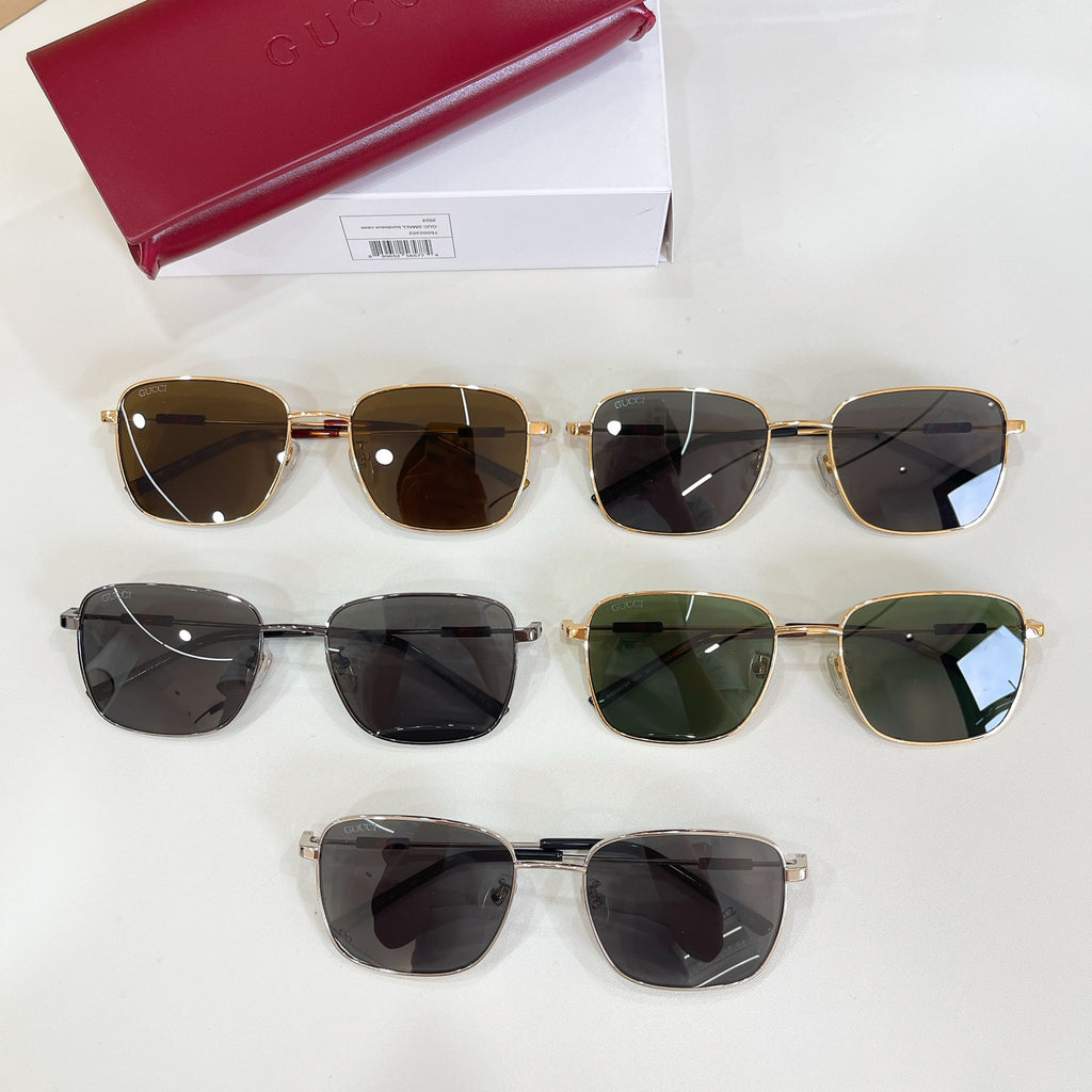Gucci sunglasses assortment with multiple pairs, dark lenses, and gold-tone frames
